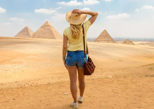 Traveler admiring the pyramids in Egypt.